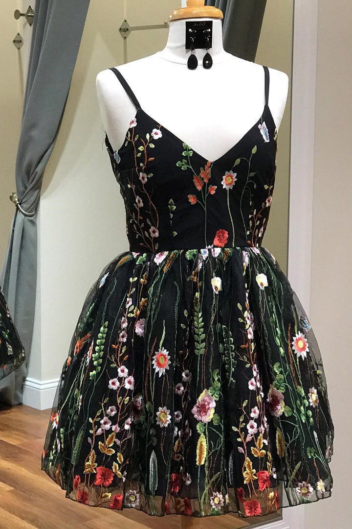 black dress with embroidered flowers